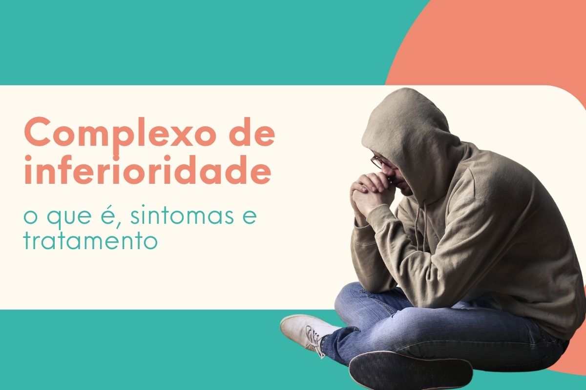 Homem sentado no chão, com capuz e postura encolhida, demonstrando tristeza e insegurança, representando o complexo de inferioridade e seus impactos emocionais.